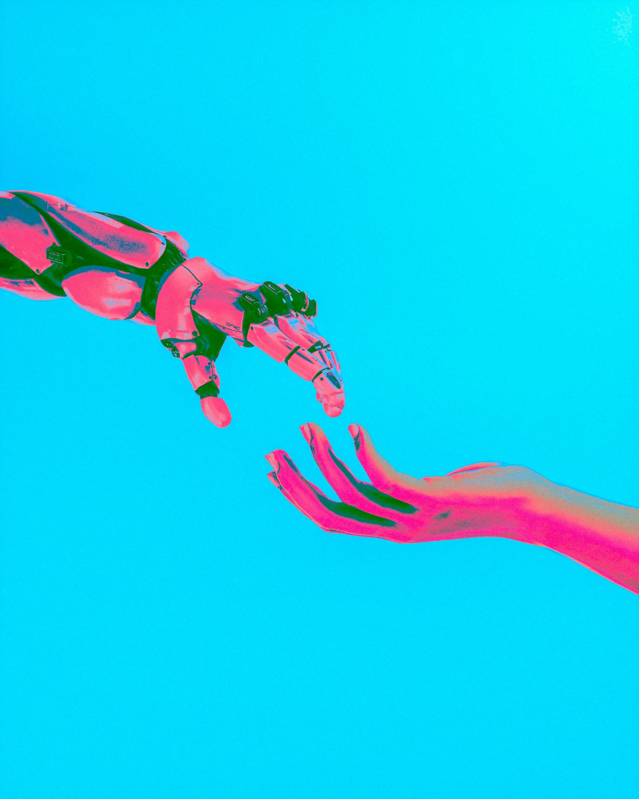 an image showing an ai hand connecting with a human hand, indicating collaboration