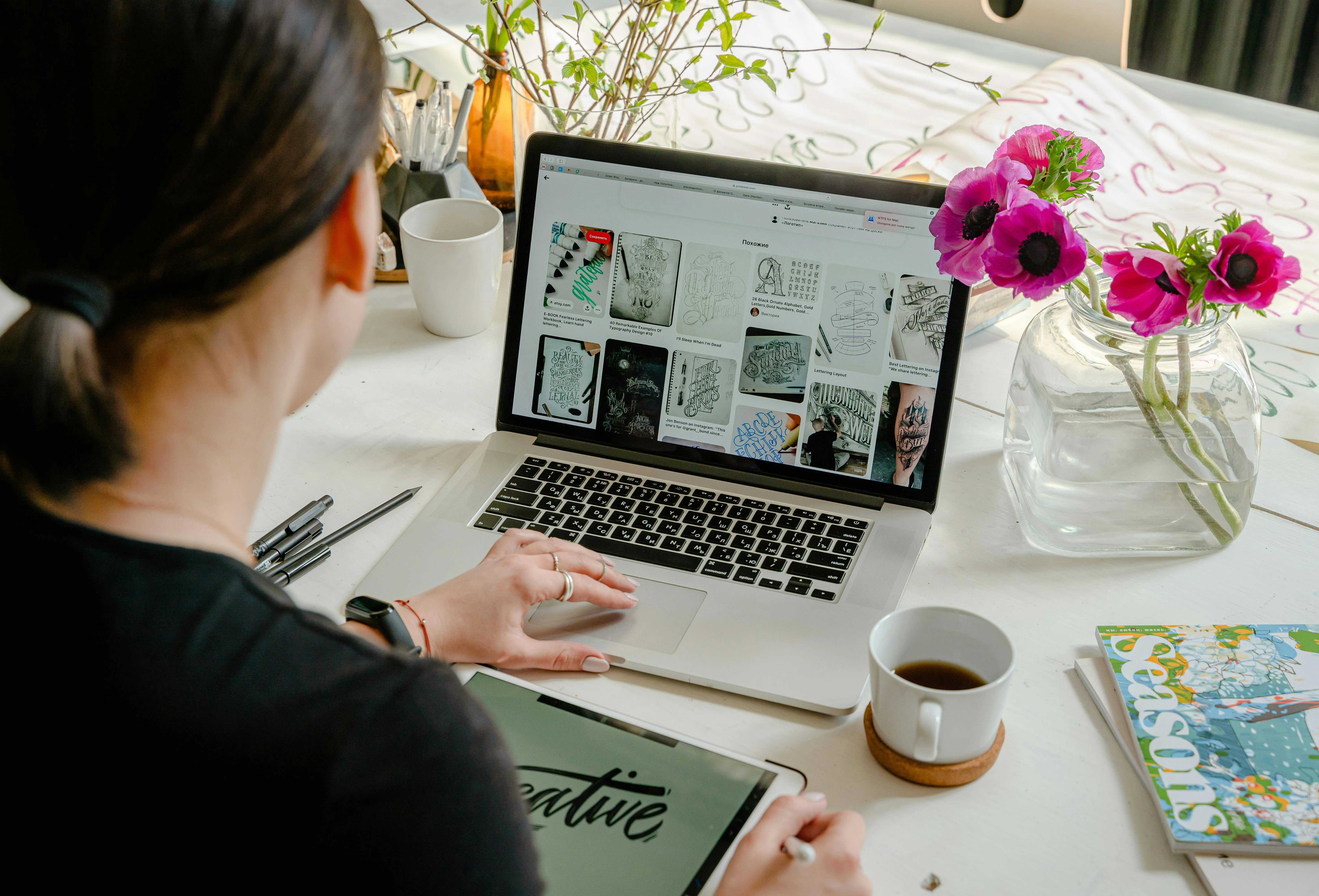 The image showcases a professional checking their digital portfolio website displayed on a laptop, emphasizing the importance of showcasing both technical and soft skills for skills-based hiring. This visual representation highlights how candidates can effectively present their abilities and experiences in a modern hiring landscape.